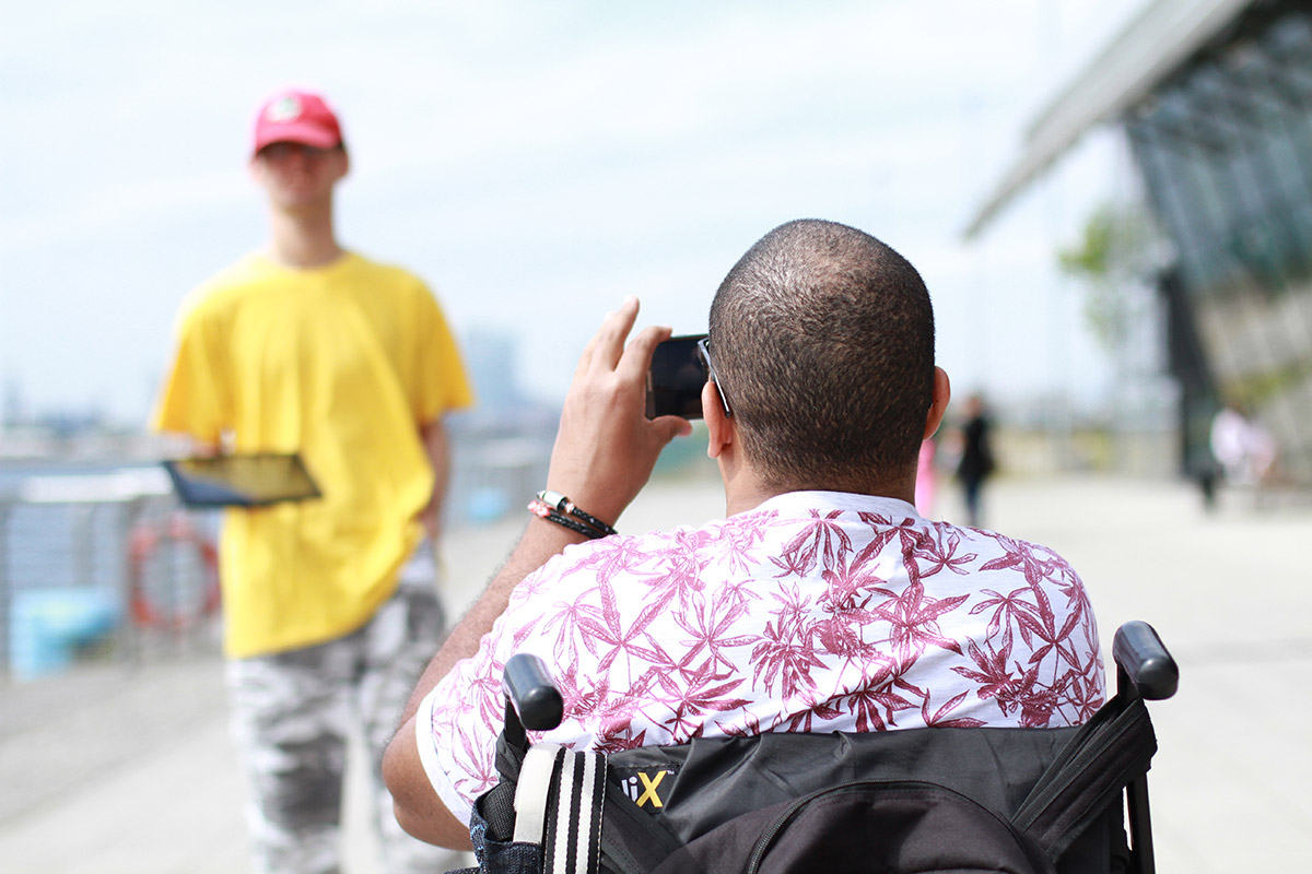 Using a phone to photograph a fellow student